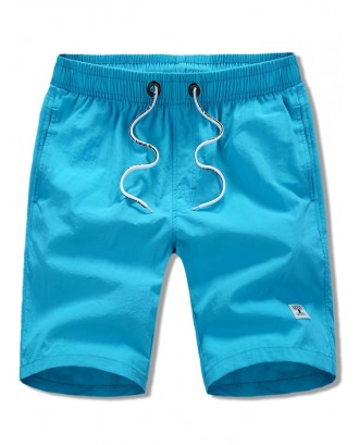 Appliques Solid Color Drawstring Beach Shorts - Blue Xs